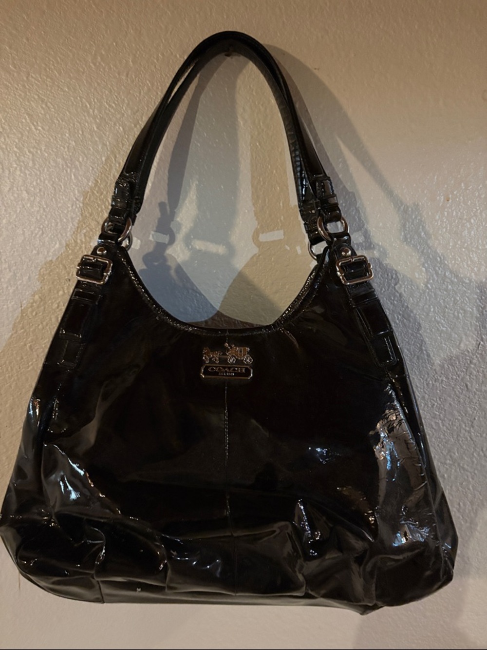 Coach purse.  Black exterior. Hot pink/purple interior.